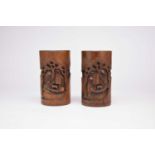 A pair of Chinese carved bamboo brush pots