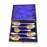 A matched set of four later embossed silver fruit spoons and sugar sifter spoon