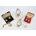 A collection of costume jewellery and wristwatches