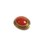 A 9ct gold mounted cabochon coral brooch