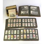 A collection of cigarette cards to various albums with some loose sets