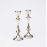 A pair of silver mounted candlesticks