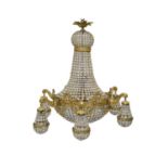 A large Empire style gilt metal and glass beaded chandelier