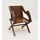 A stained oak 'Glastonbury' chair, Gothic style, circa 1900