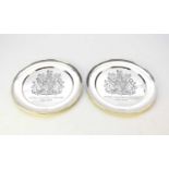 A pair of silver commemorative plates to celebrate the Silver Jubilee