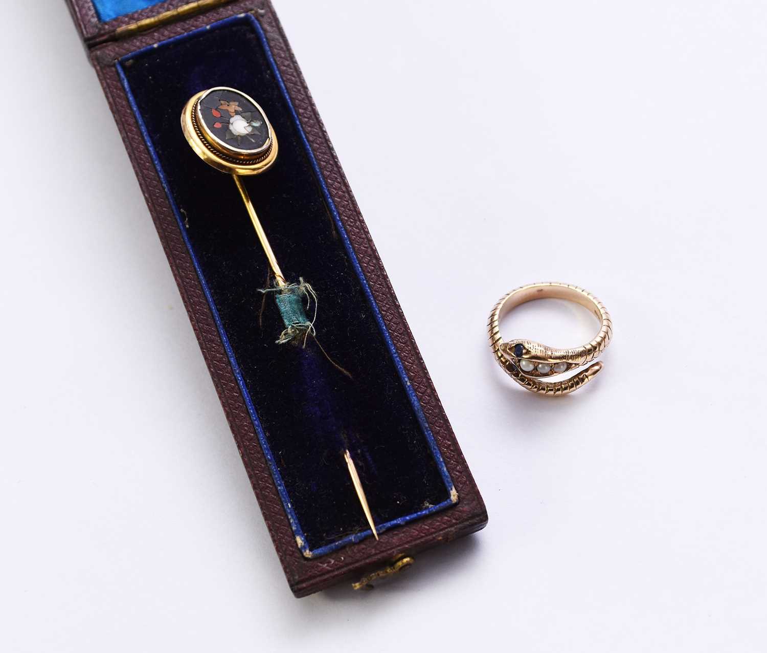 A 9ct gold pearl and sapphire snake ring and a stick pin
