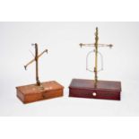 Two cased scientific balance scales and two travelling scales