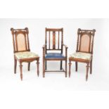 A set of six carved oak dining chairs and a pair of associated oak carvers