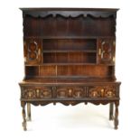 A 20th century, stained oak, Jacobean style dresser