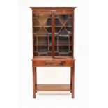 An Edwardian mahogany glazed bookcase on associated stand