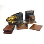 An Edwardian magic lantern and two bellows cameras