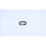 A diamond and garnet eternity ring