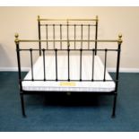 A Seventh Heaven brass and iron double bedstead