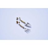 A pair of 9ct yellow and white gold trowel and fork earrings