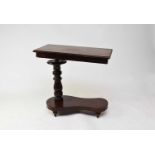 A Victorian mahogany adjustable reading table