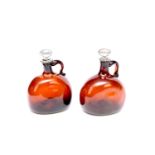 A pair of Victorian amber glass spirit decanters for Brandy and Whiskey