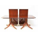 A George III style mahogany twin-pedestal dining table