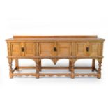 A 20th century, Renaissance style, pale oak dresser base