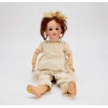 A Continental bisque-headed doll