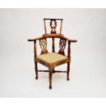A 19th century, 18th century style, fruitwood corner chair