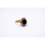 An 18ct gold sapphire & diamond oval cluster ring