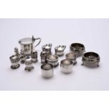 A collection of silver cruets and napkin rings