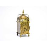 A reproduction brass lantern clock