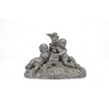 Probably Coalbrookdale, a bronze group of two cherubs below a tree stump, 21cm long