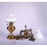 A brass hanging oil lamp and a brass oil table lamp