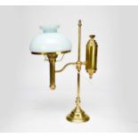 A reproduction brass adjustable desk lamp