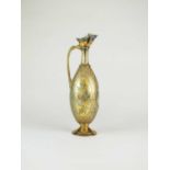 A Victorian silver gilt wine ewer