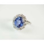 A platinum sapphire and diamond cluster ring