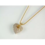 An 18ct gold diamond heart pendant