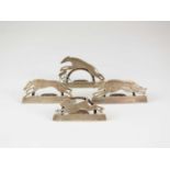 A set of four novelty silver menu holders in the form of greyhounds and a hare