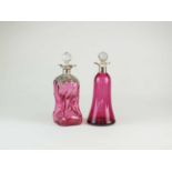 Two silver mounted cranberry glass decanters