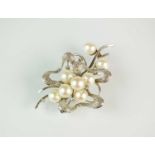 A cultured pearl and diamond spray brooch