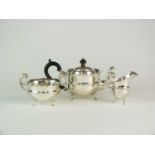 A three piece silver tea service