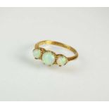 A graduated three stone opal ring