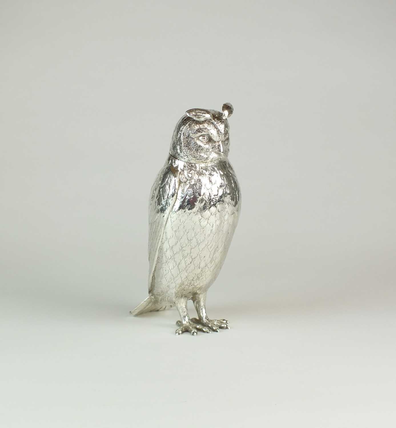 An impressive Edwardian Goldsmiths and Silversmiths Co Ltd silver sugar caster in the form of an owl