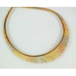 A tri-coloured metal fringe necklace