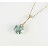 An early 20th century aquamarine and diamond pendant