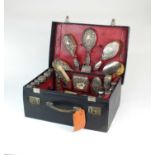 A harlequin silver mounted travelling dressing table set