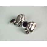 A pair of Asprey silver and enamel elephant cufflinks