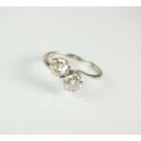 A two stone diamond crossover ring