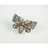 A late 19th century diamond, pearl and ruby butterfly brooch