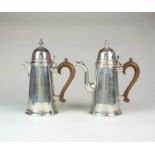 A Queen Anne style silver coffee pot and hot water jug