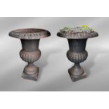 A good pair of Victorian cast iron urns