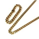 A 9ct gold flat curb link necklace and a yellow metal matching bracelet