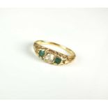 A 19th century three stone diamond and emerald ring