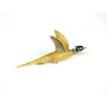 A yellow metal and enamel pheasant bar brooch